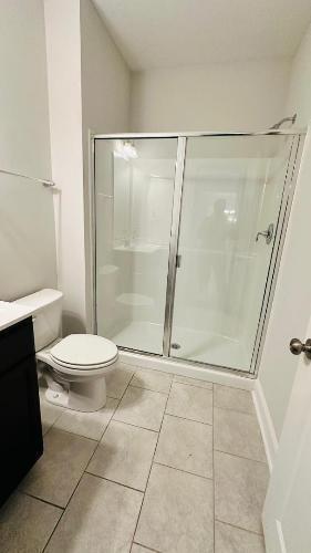 232 Chateau Way Angier, NC 27501 - Photo 15 of 23 a bathroom with a toilet and a shower