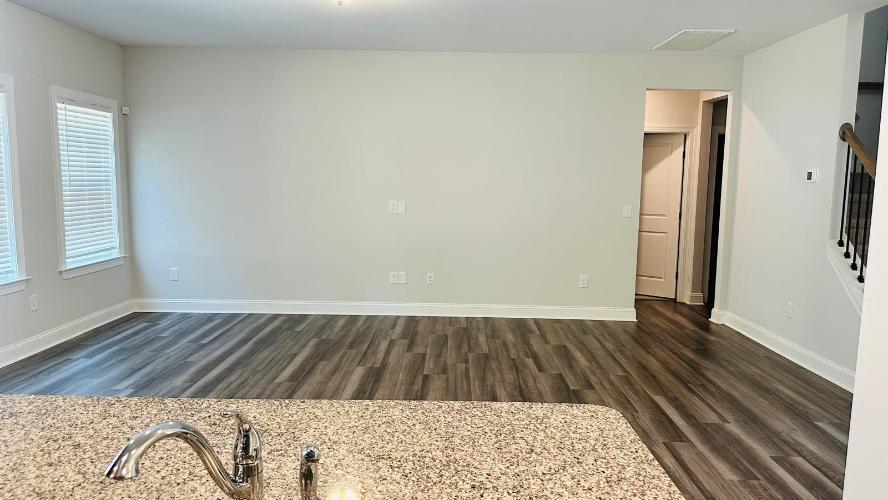 232 Chateau Way Angier, NC 27501 - Photo 17 of 23 an empty room with wooden floor and a window