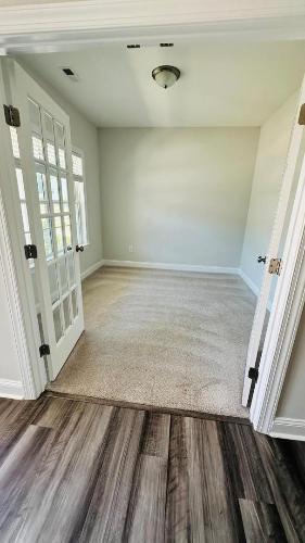 232 Chateau Way Angier, NC 27501 - Photo 22 of 23 a view of wooden floor in a room