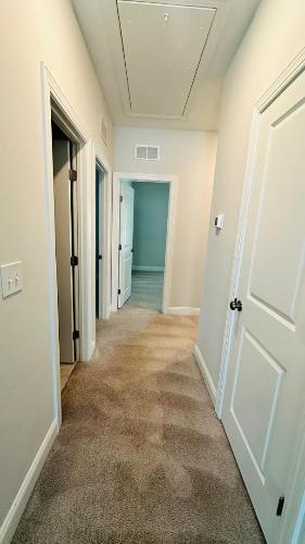 232 Chateau Way Angier, NC 27501 - Photo 7 of 23 view of a hallway with wooden shelves