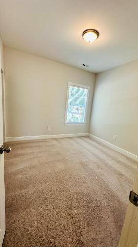232 Chateau Way Angier, NC 27501 - Photo 9 of 23 an empty room with a window