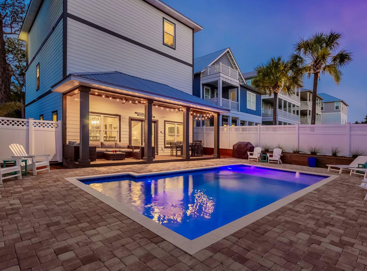 a view of swimming pool with a lounge chairs