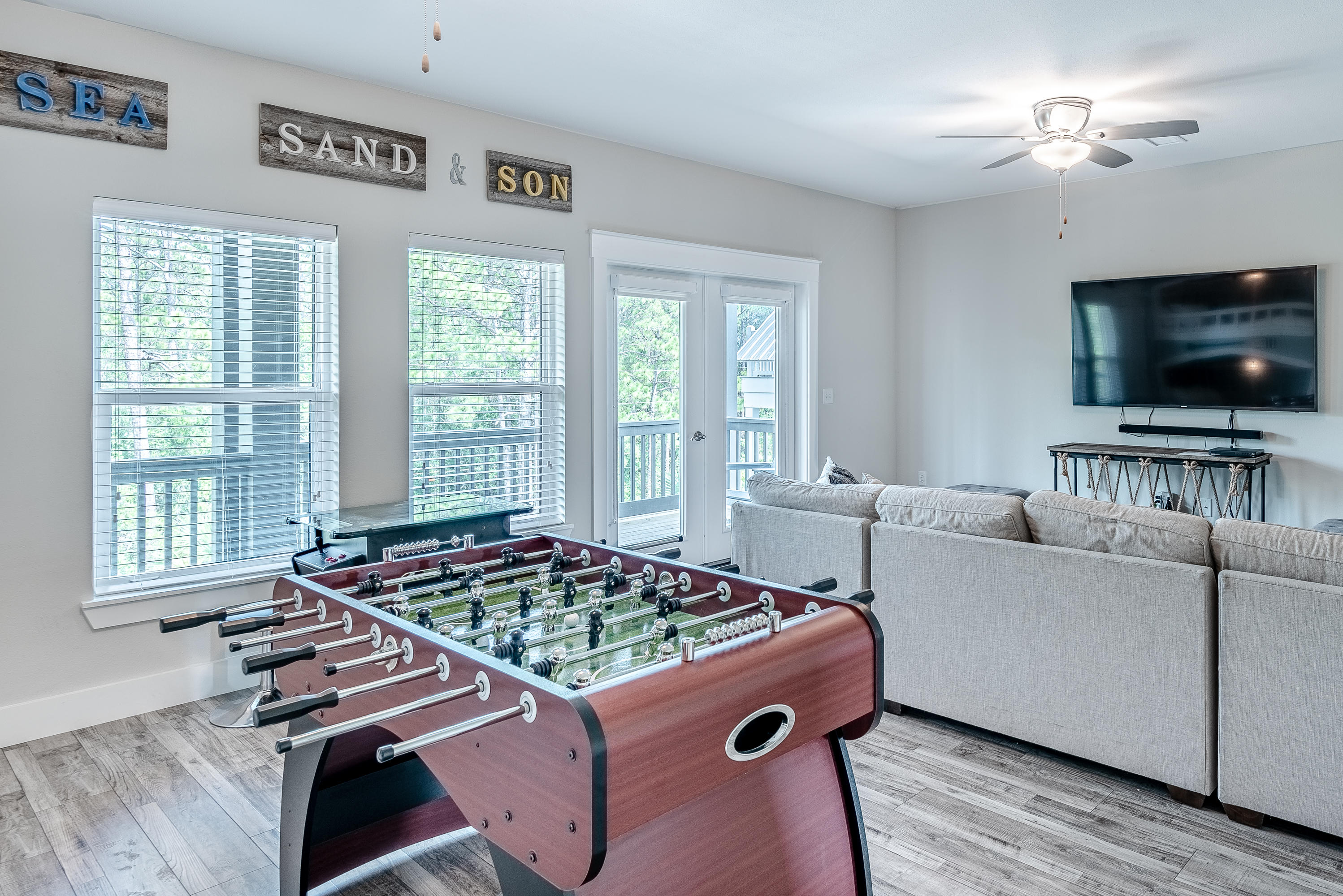 109 Santa Clara Street Santa Rosa Beach, FL 32459 - Photo 19 of 41 a living room with furniture and a flat screen tv