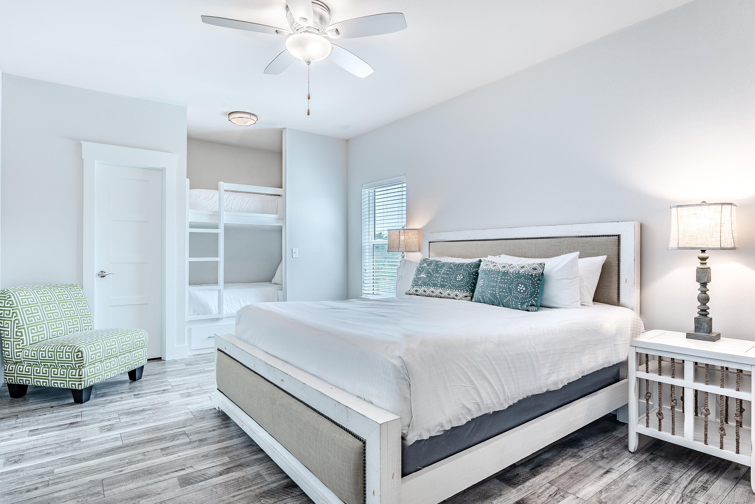 109 Santa Clara Street Santa Rosa Beach, FL 32459 - Photo 23 of 41 a bedroom with a bed and a chandelier