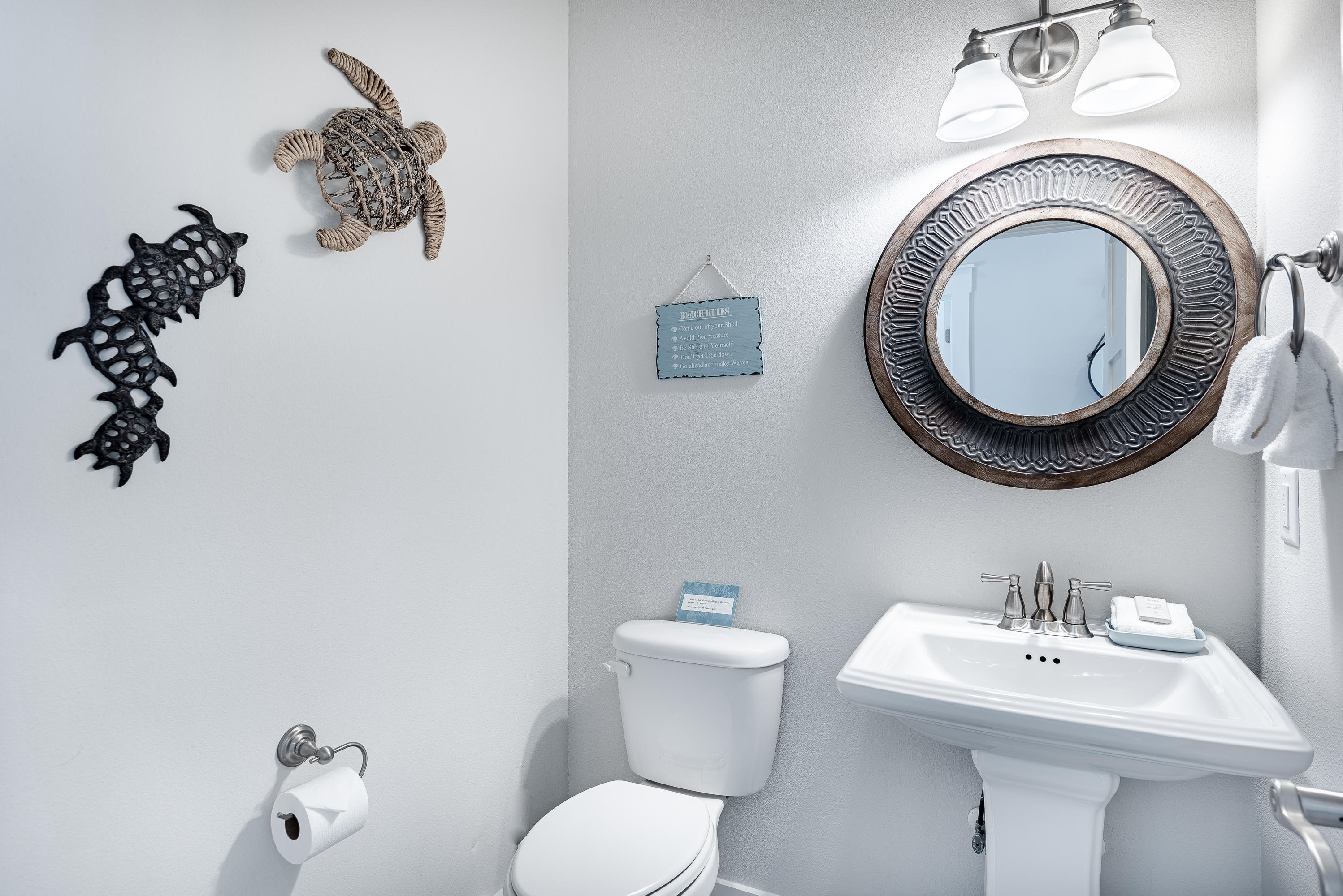 109 Santa Clara Street Santa Rosa Beach, FL 32459 - Photo 9 of 41 a bathroom with a toilet sink and mirror