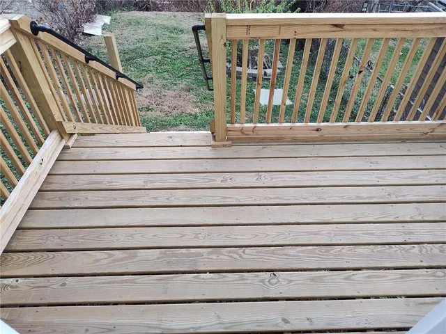 a view of a kitchen with a sink cabinets and wooden floor