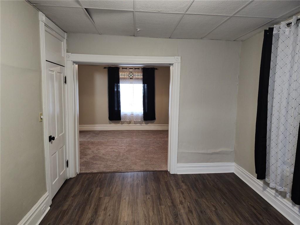 533 3rd Street Pitcairn, PA 15140 - Photo 13 of 37 a hallway with wooden floor chandelier and front door