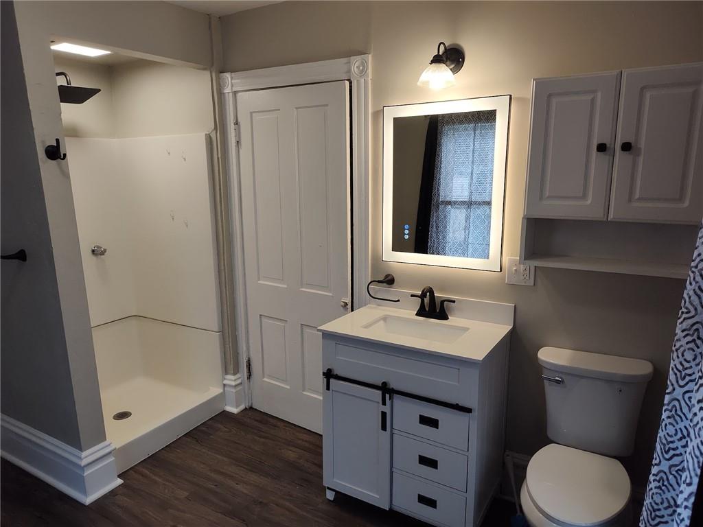 533 3rd Street Pitcairn, PA 15140 - Photo 19 of 37 a bathroom with a sink a toilet and shower
