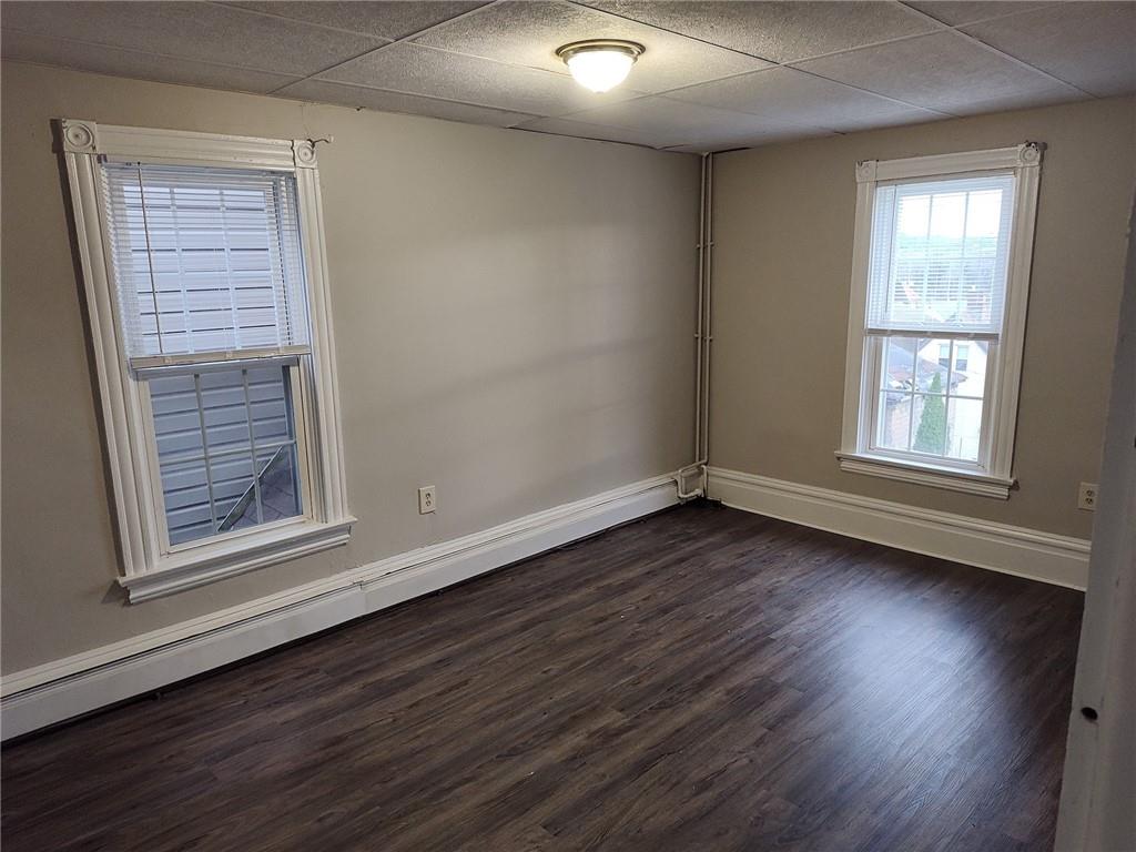 533 3rd Street Pitcairn, PA 15140 - Photo 21 of 37 an empty room with wooden floor and windows