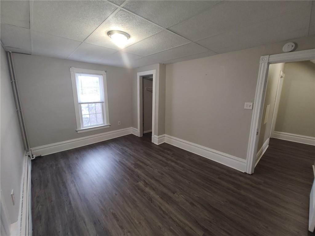 533 3rd Street Pitcairn, PA 15140 - Photo 22 of 37 an empty room with wooden floor and windows