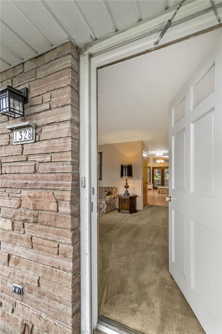 1328 Russett Road Allentown, PA 18104 - Photo 5 of 46 Enter into a welcoming interior with a blend of carpet and tiled flooring, hinting at comfortable living.