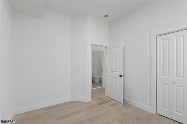 an empty room with closet area