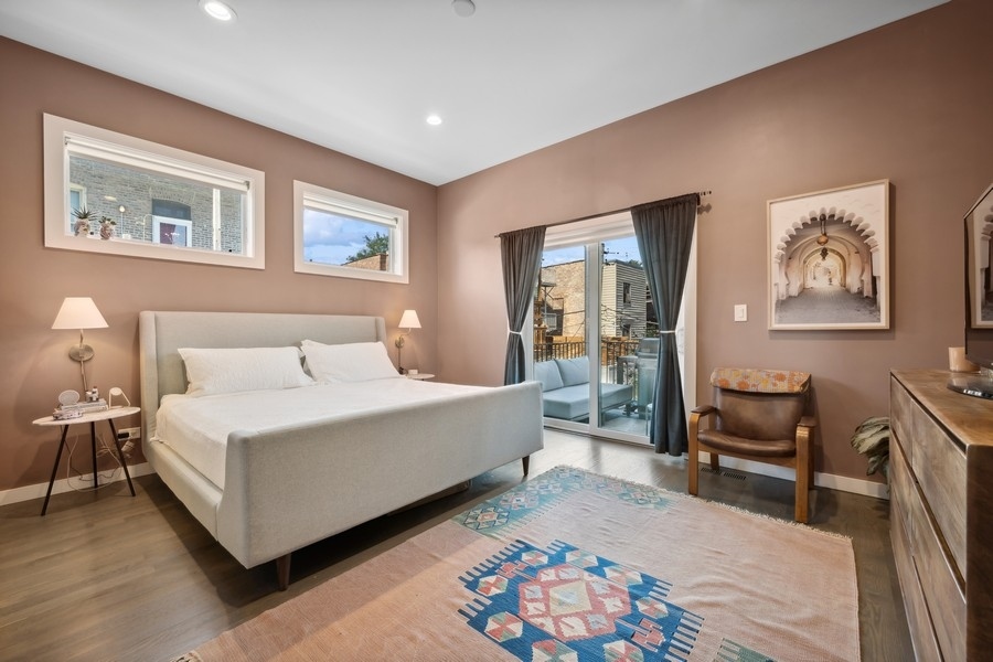 2046 West Rice Street, Unit 2 Chicago, IL 60622 - Photo 9 of 14 a bedroom with a bed and a couch