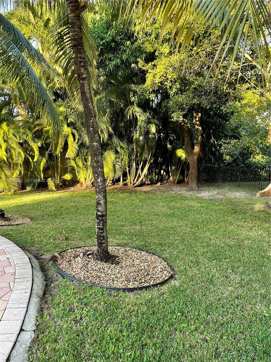 2160 Southwest 16th Avenue, Unit 115 Miami, FL 33145 - Photo 22 of 31 a view of a garden with trees