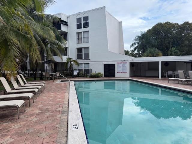 2160 Southwest 16th Avenue, Unit 115 Miami, FL 33145 - Photo 25 of 31 a view of a swimming pool with a patio