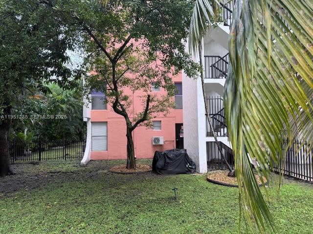 2160 Southwest 16th Avenue, Unit 115 Miami, FL 33145 - Photo 28 of 31 a front view of a house with a yard