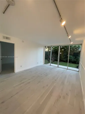 a view of an empty room with a fireplace