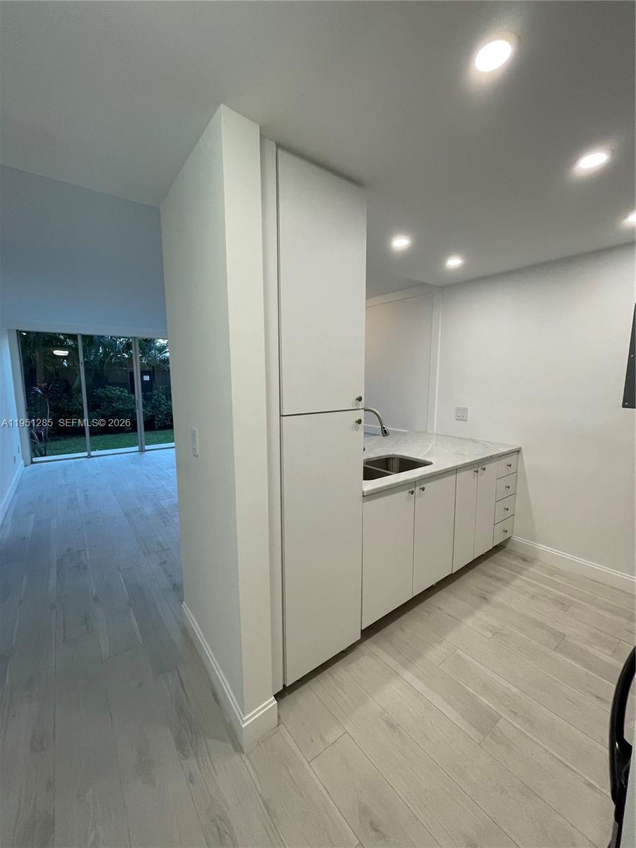 2160 Southwest 16th Avenue, Unit 115 Miami, FL 33145 - Photo 8 of 31 a view of kitchen with stainless steel appliances a refrigerator and window