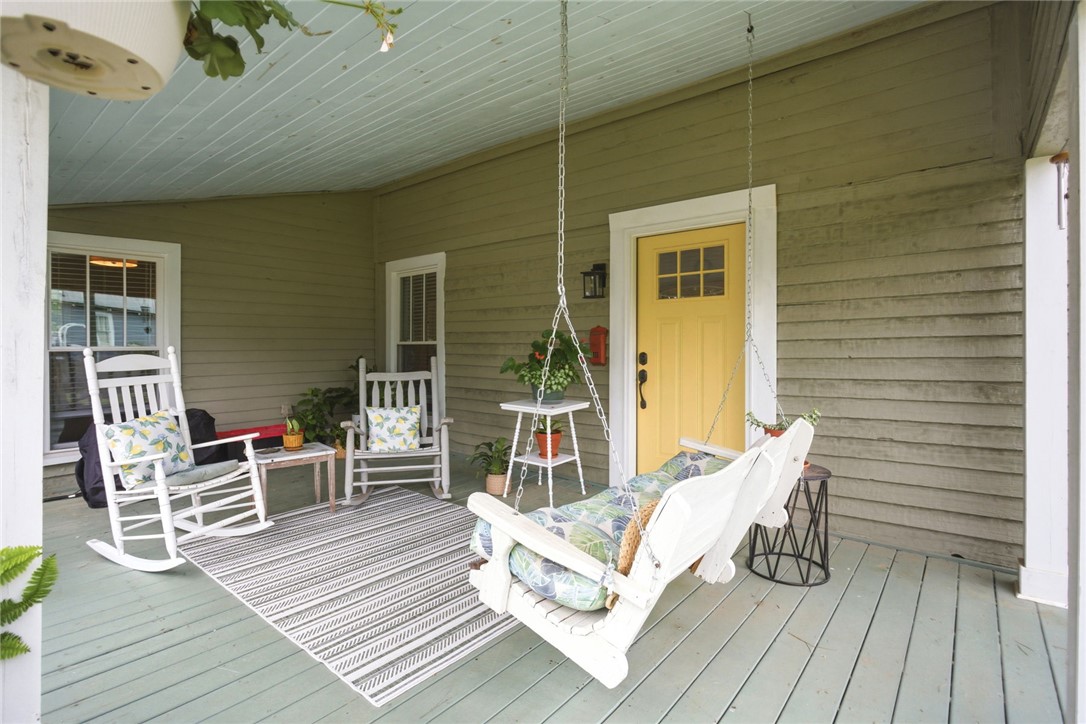 314 South Fairplay Street Seneca, SC 29678 - Photo 19 of 50 Relax on this charming porch, featuring ample space for outdoor living.