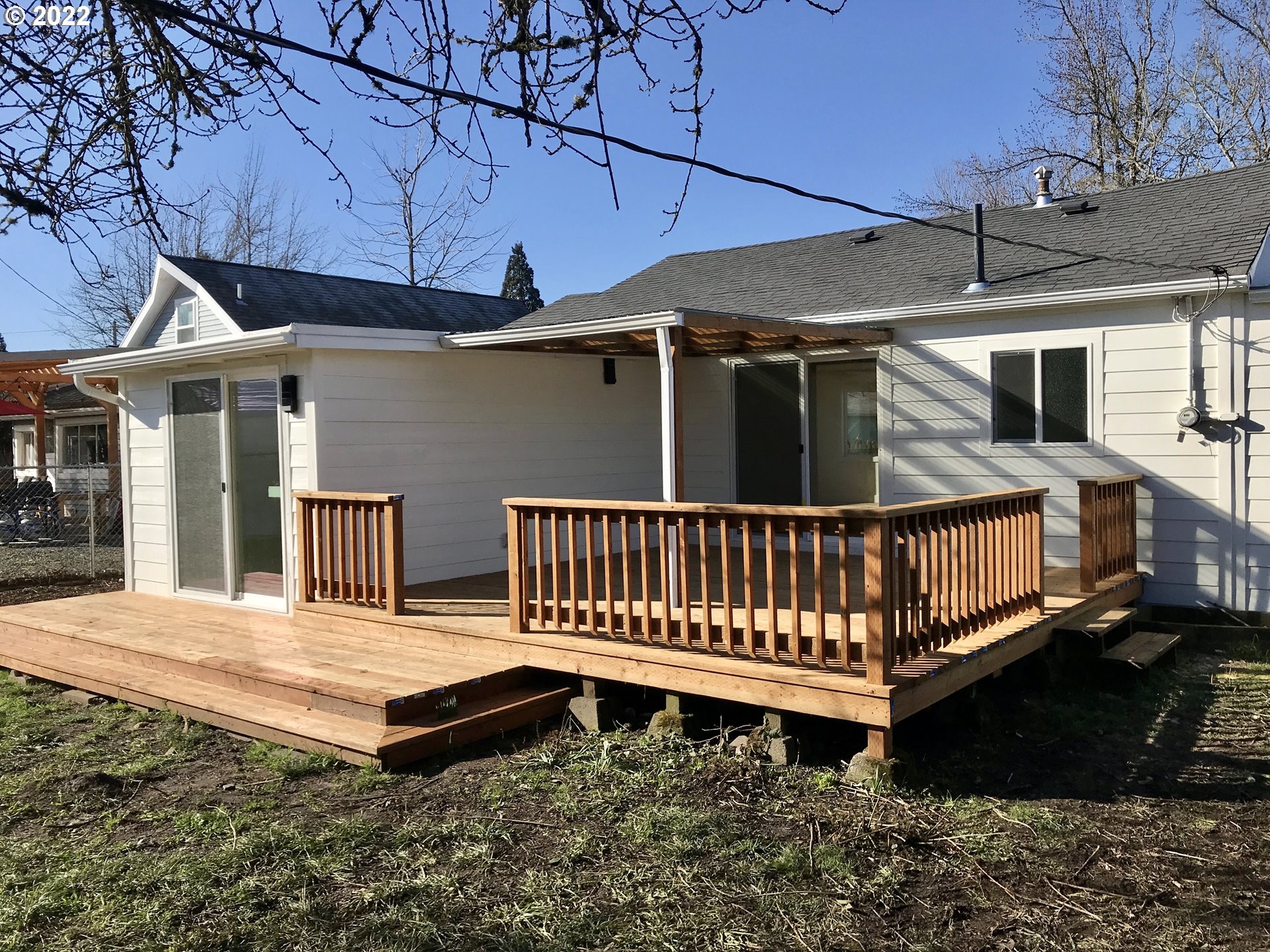 1141 1st Street Springfield, OR 97477 - Photo 12 of 13 a view of a house with a wooden deck