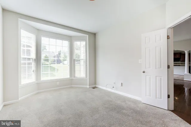 a view of empty room with floor to ceiling window