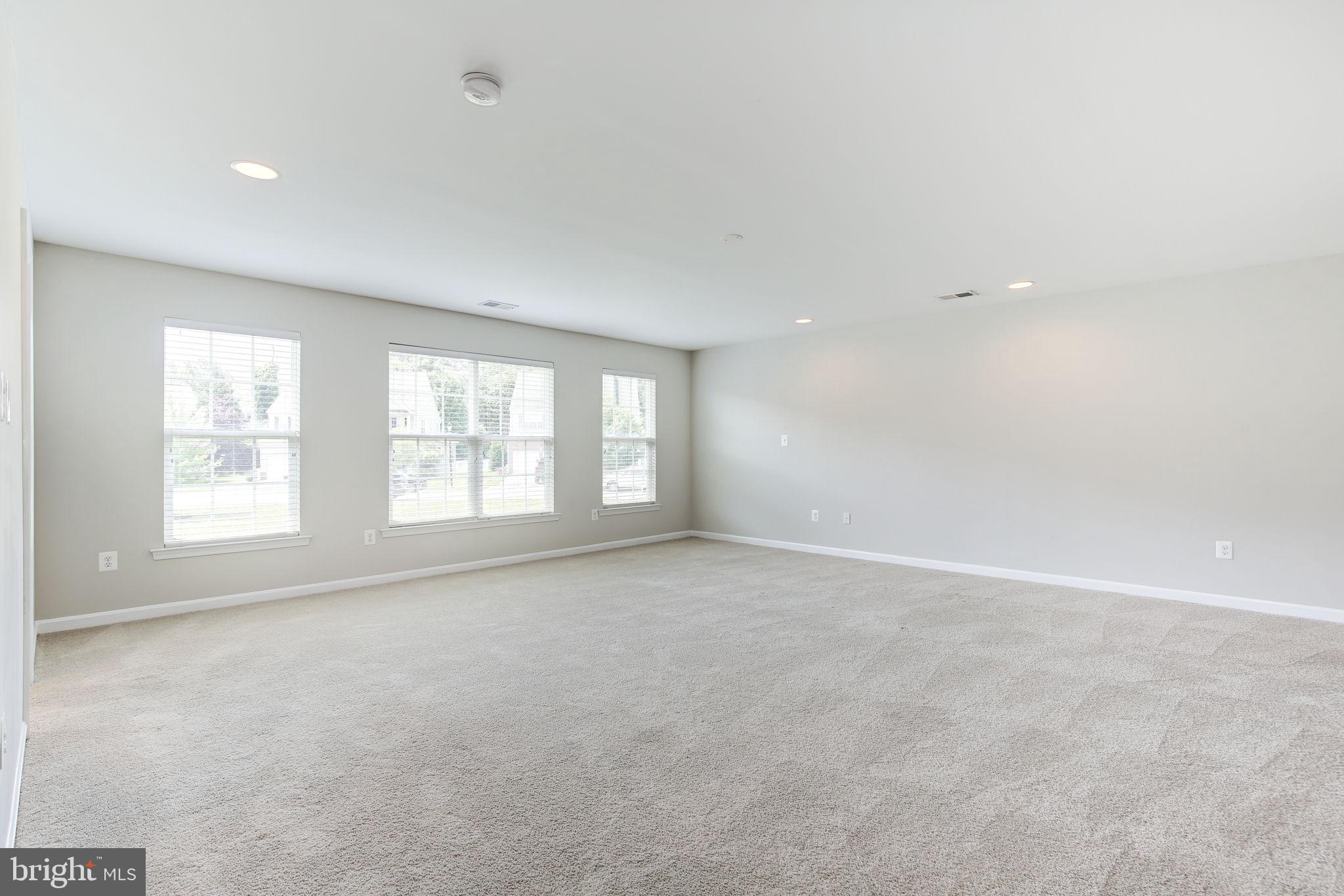 2311 Whitley Road Baltimore, MD 21209 - Photo 23 of 47 an empty room with windows
