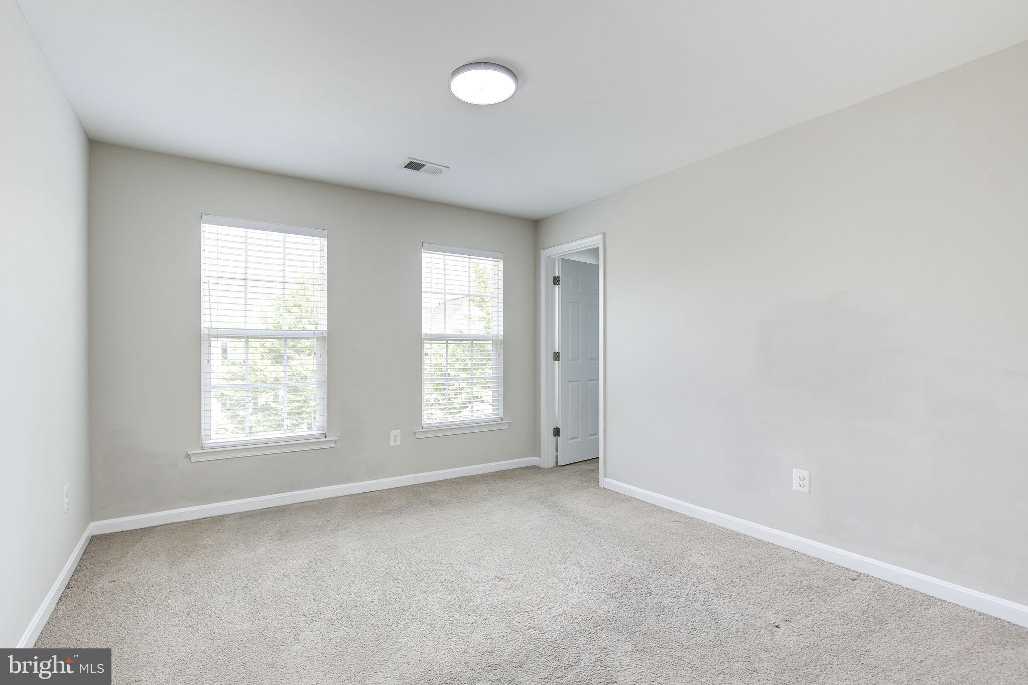 2311 Whitley Road Baltimore, MD 21209 - Photo 36 of 47 an empty room with windows