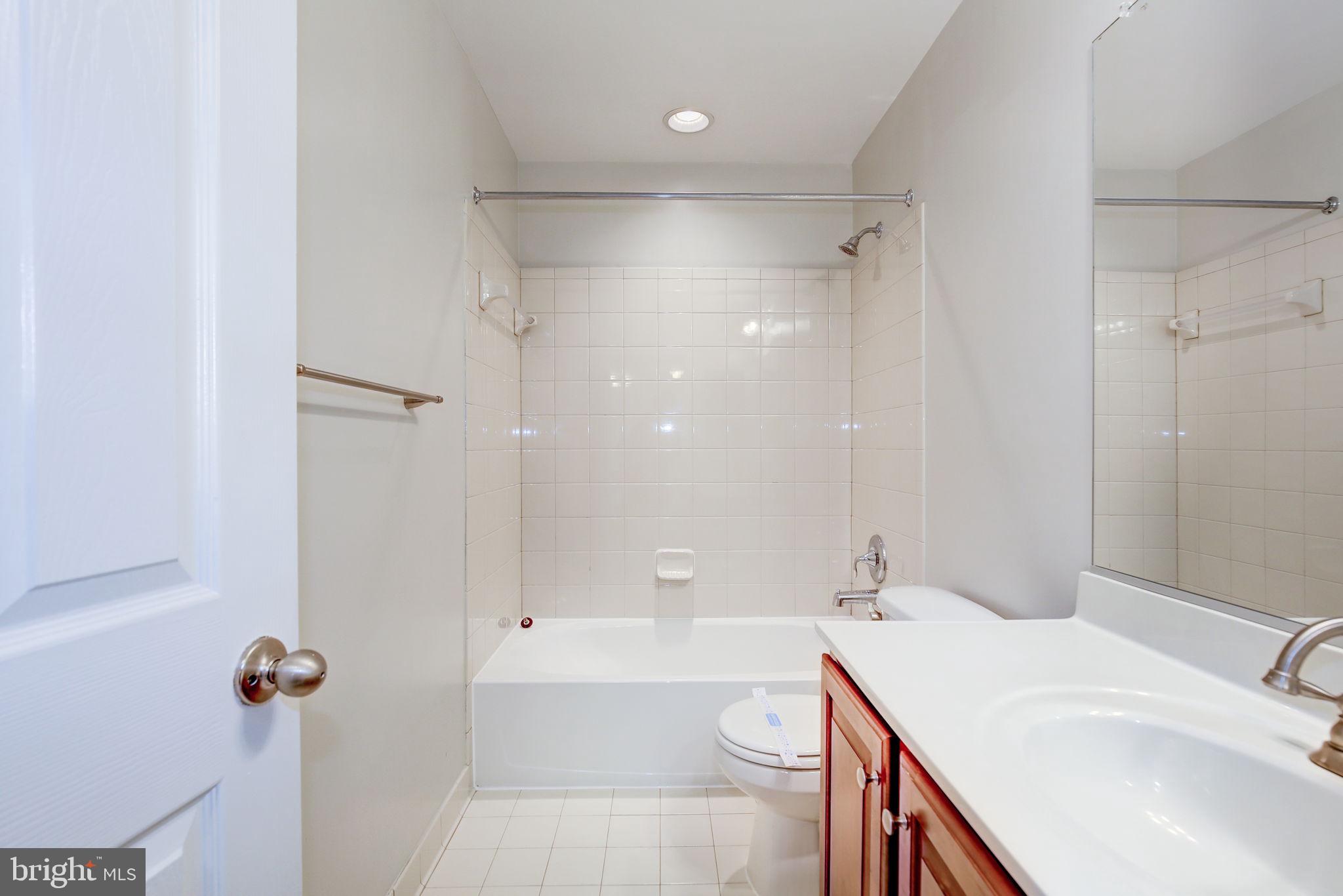 2311 Whitley Road Baltimore, MD 21209 - Photo 39 of 47 a bathroom with a sink a toilet and shower