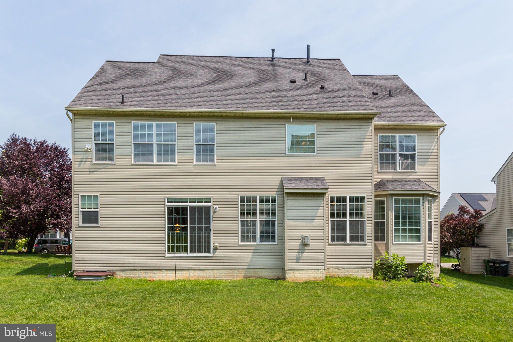 2311 Whitley Road Baltimore, MD 21209 - Photo 45 of 47 a front view of a house with a yard