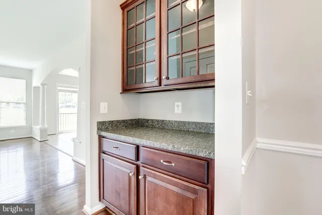 a view of a kitchen cabinets and a stove top oven
