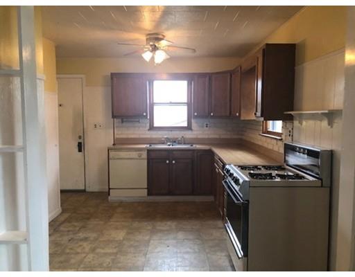 113 King Philip Road Worcester, MA 01606 - Photo 5 of 16 a kitchen with a stove sink and cabinets