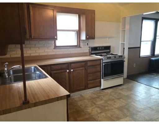 113 King Philip Road Worcester, MA 01606 - Photo 6 of 16 a kitchen with a sink stove and cabinets
