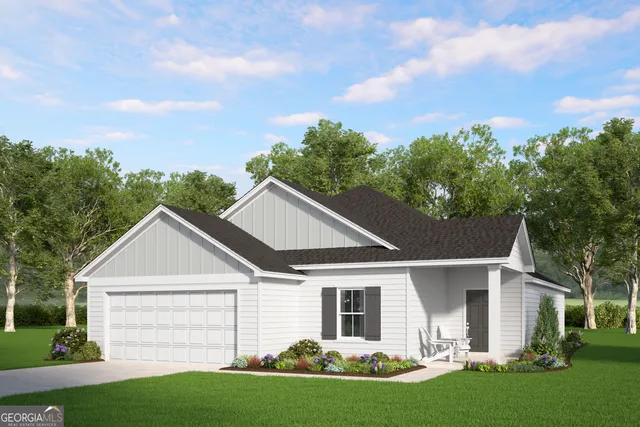 a view of a yard in front of a house with plants and large tree