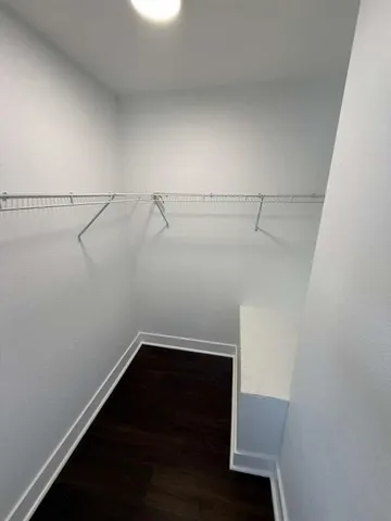 a view of storage and utility room with racks on the wall