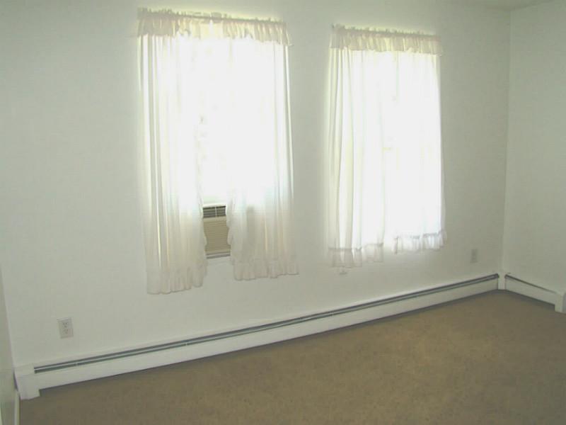 23 Buck Road Middletown, RI 02842 - Photo 12 of 21 Master Bedroom. Two large windows provide nice light and cool breezes.