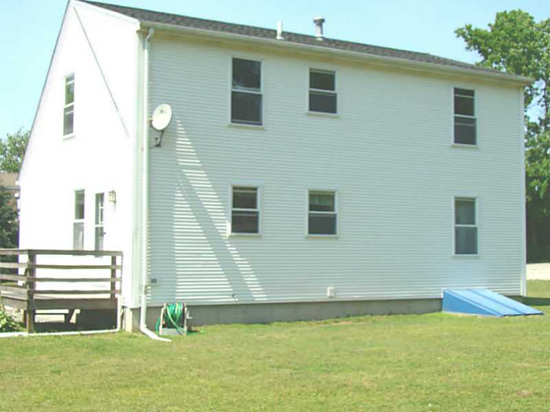 23 Buck Road Middletown, RI 02842 - Photo 2 of 21 Exterior Back. Full dormer on 2nd floor provides great space to expand.