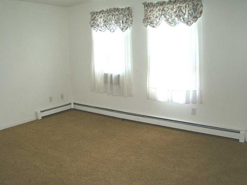 23 Buck Road Middletown, RI 02842 - Photo 5 of 21 Living Room. 2 Large windows bring in nice light.
