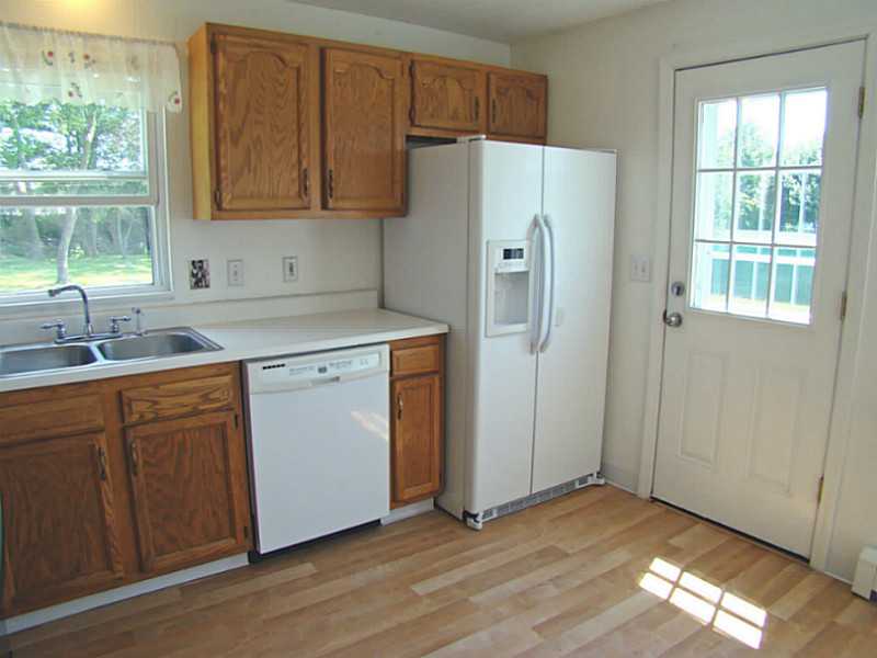 23 Buck Road Middletown, RI 02842 - Photo 8 of 21 Kitchen. Side door to deck and parking
