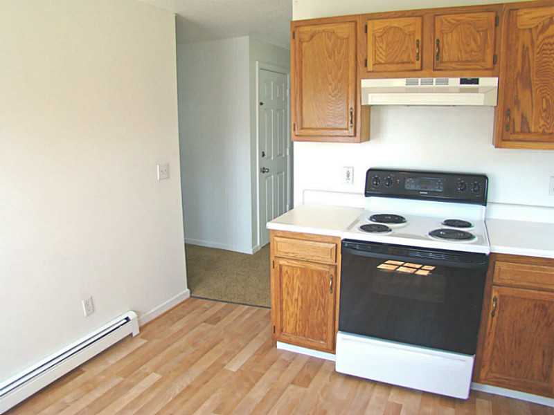 23 Buck Road Middletown, RI 02842 - Photo 10 of 21 Kitchen. Living room to the left. Bath and bedrooms down the hallway.