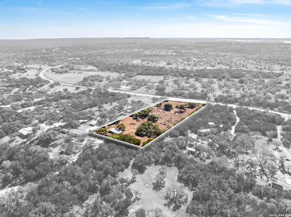 an aerial view of beach and residential building