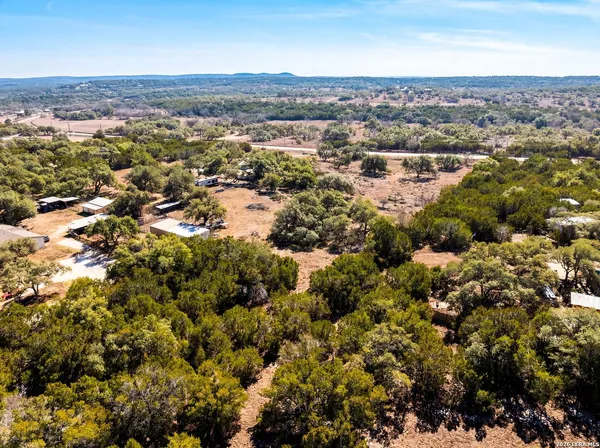 an aerial view of a house with a city