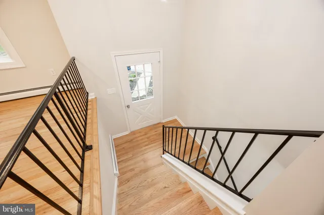 a view of a balcony with wooden floor