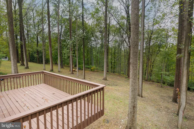 a view of a house with backyard porch and sitting area