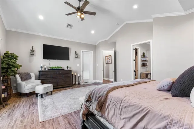 a bedroom with a bed and a walk in closet