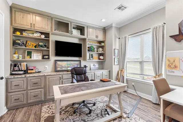a bathroom with a granite countertop sink a toilet and shower