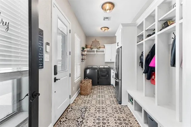 a living room with furniture a flat screen tv and large window