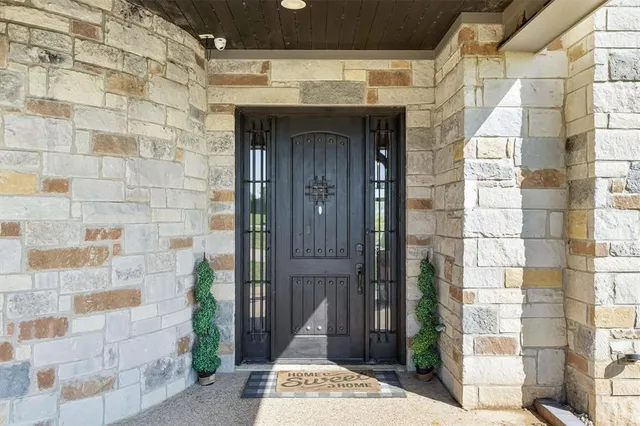 a view of a brick house with a entrance
