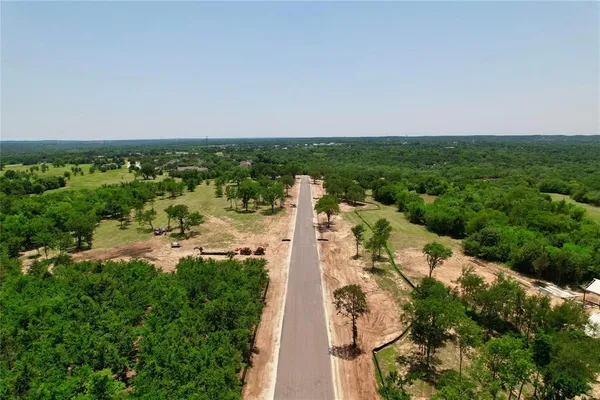 a view of a road with a trees