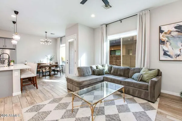 a living room with furniture and a large window