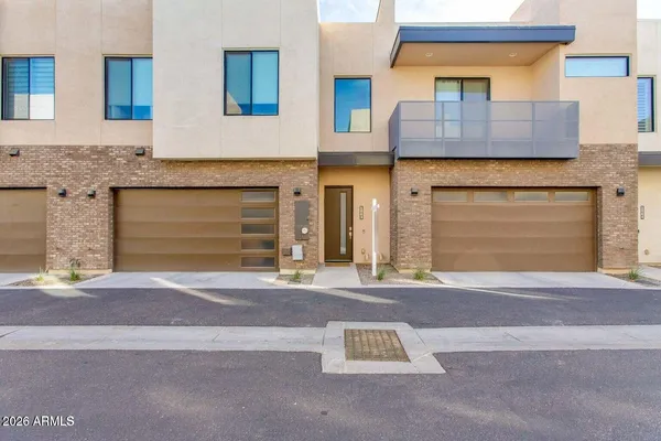 a front view of a house with a garage